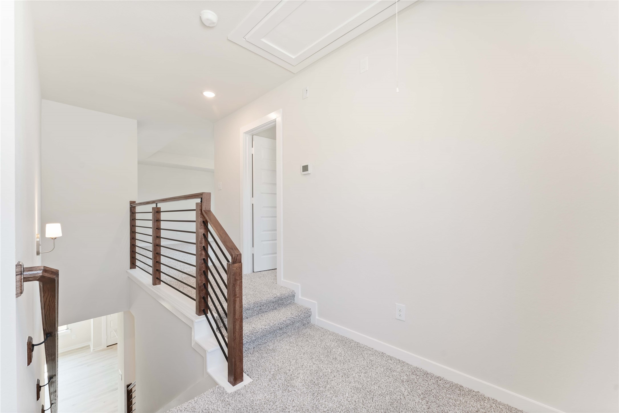 25992 Liberation Road Cleveland, TX 77328 - Photo 17 of 27 a view of a hallway with staircase