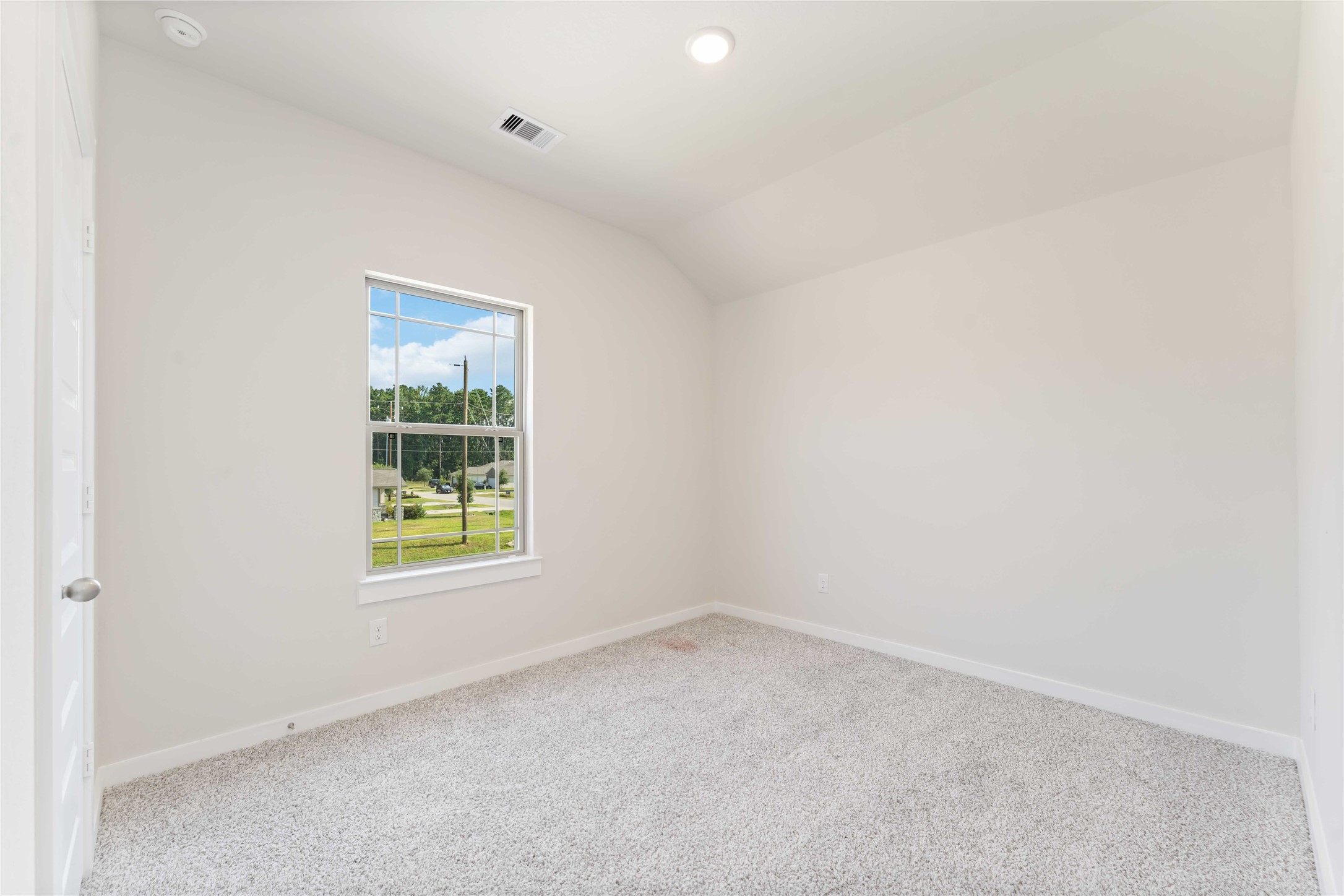 25992 Liberation Road Cleveland, TX 77328 - Photo 21 of 27 an empty room with a window