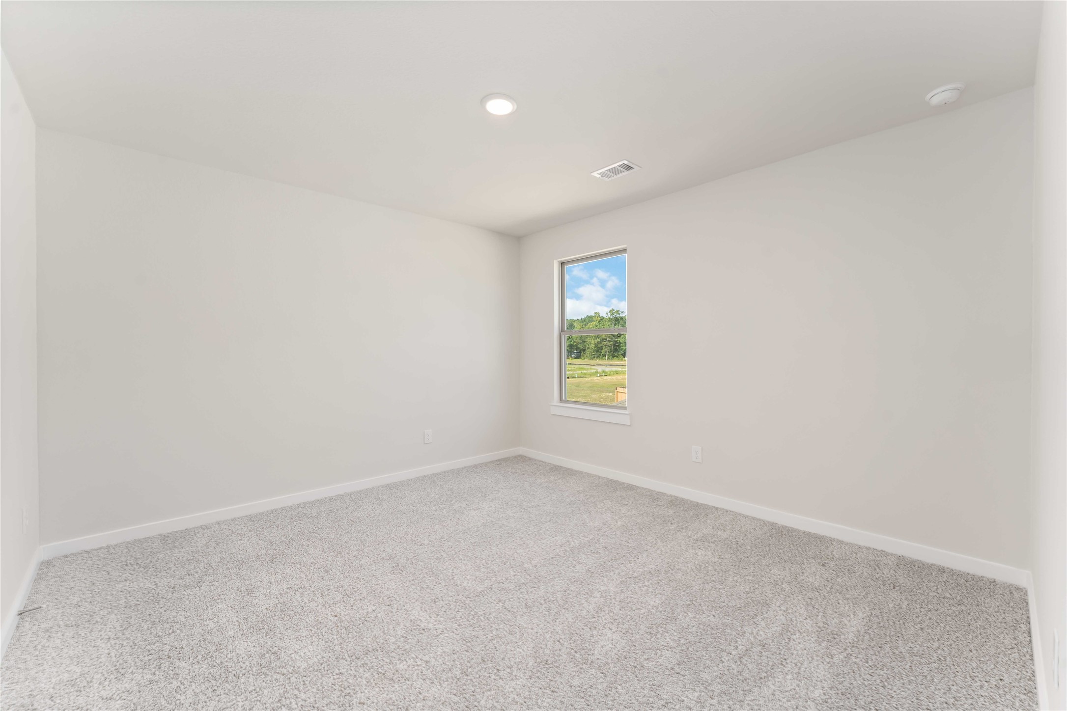 25992 Liberation Road Cleveland, TX 77328 - Photo 24 of 27 an empty room with windows