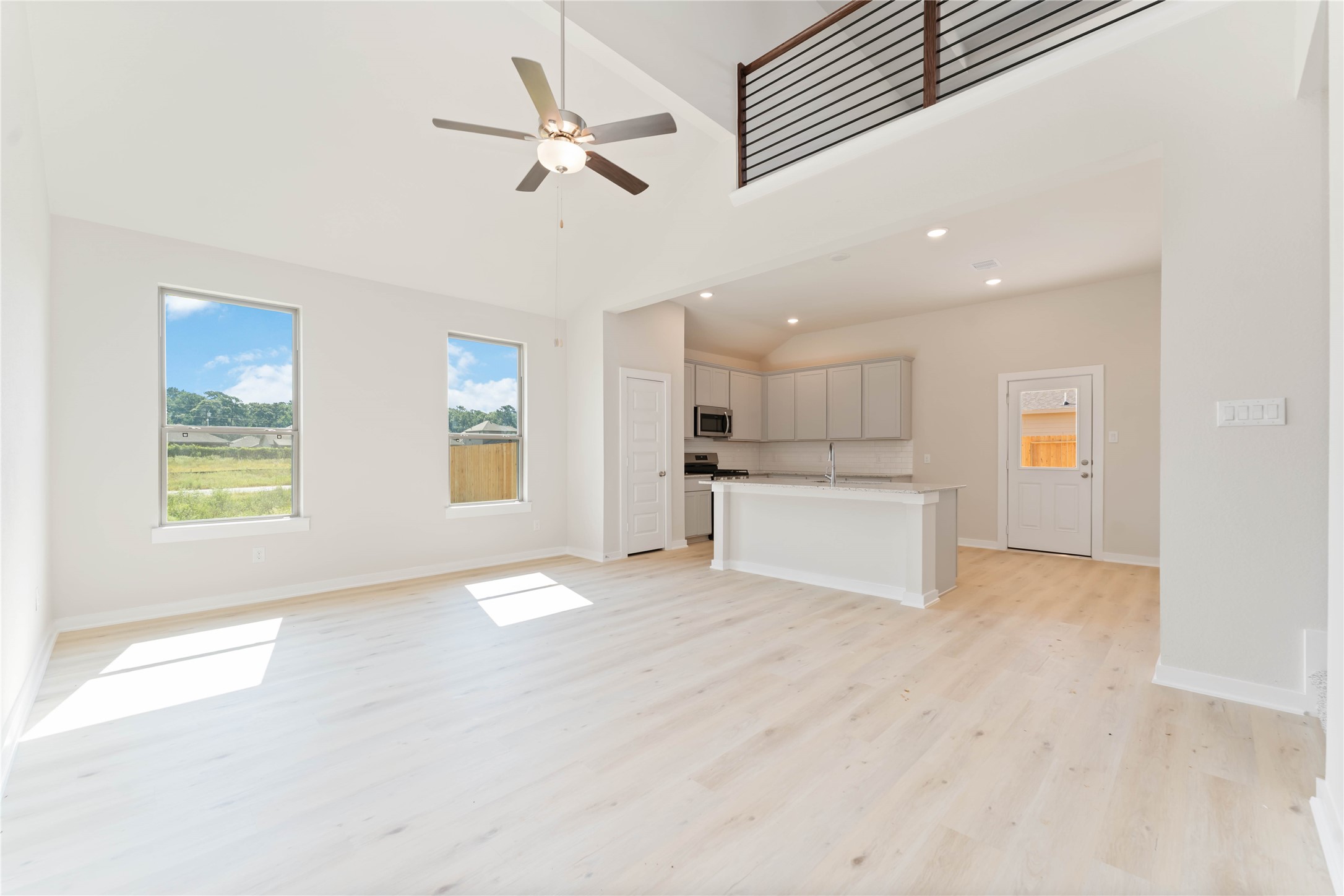 25992 Liberation Road Cleveland, TX 77328 - Photo 7 of 27 a view of an empty room with a window