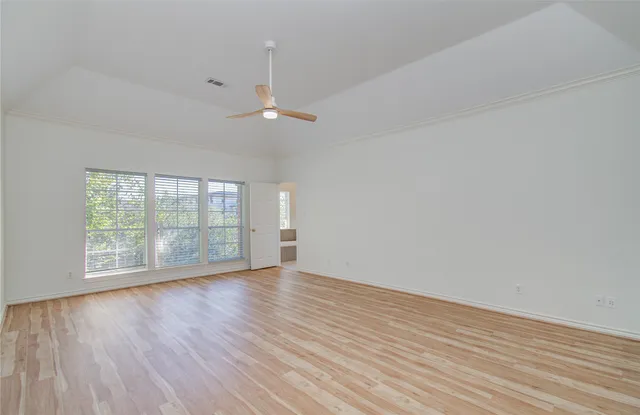 a view of a room with stairs and a wooden floor