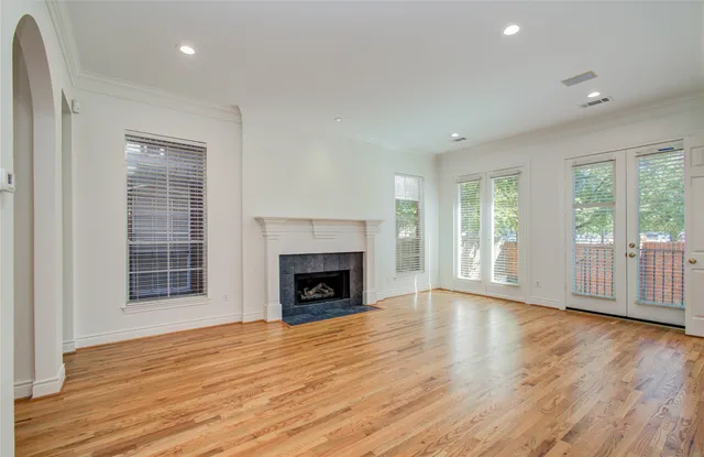 a view of a kitchen with wooden floor and a sink