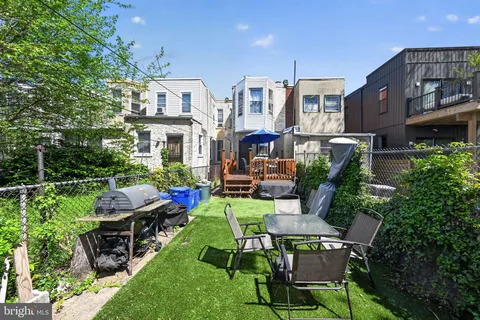 a view of a patio in back of a house