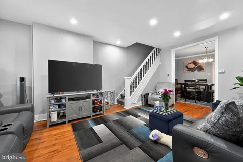 a living room with furniture and a flat screen tv