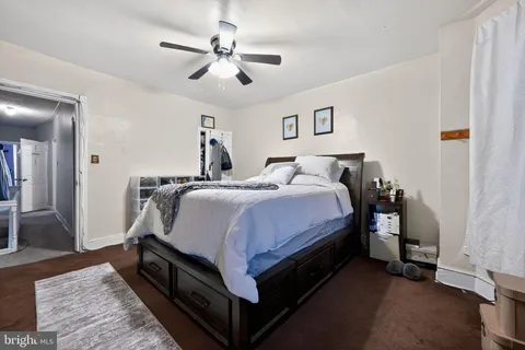 a bed room with a bed and a chandelier