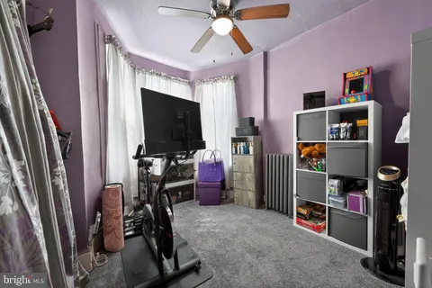a room with furniture and a flat screen tv