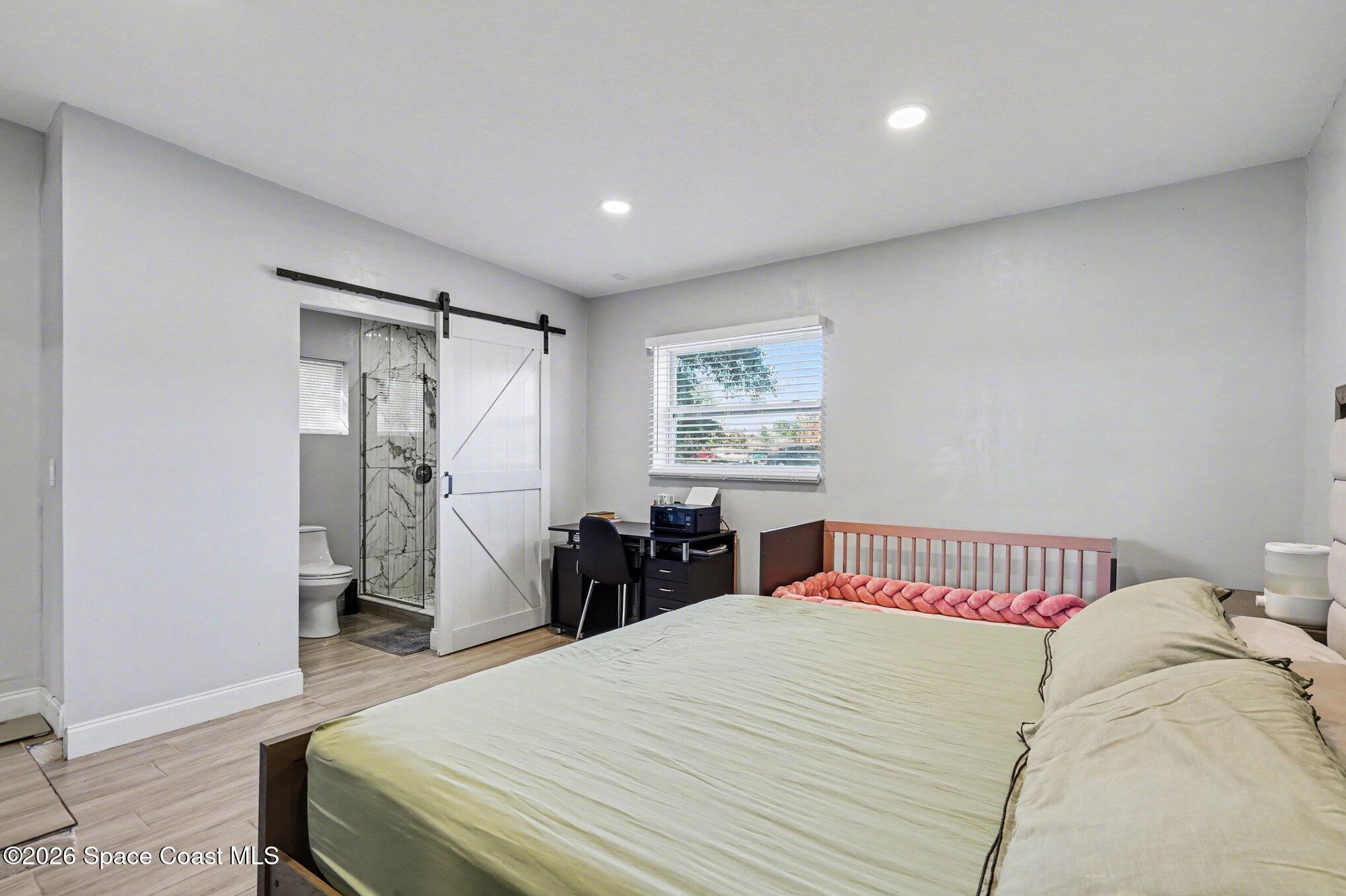 809 Espanola Way Melbourne, FL 32901 - Photo 12 of 27 a bedroom with a bed and a closet