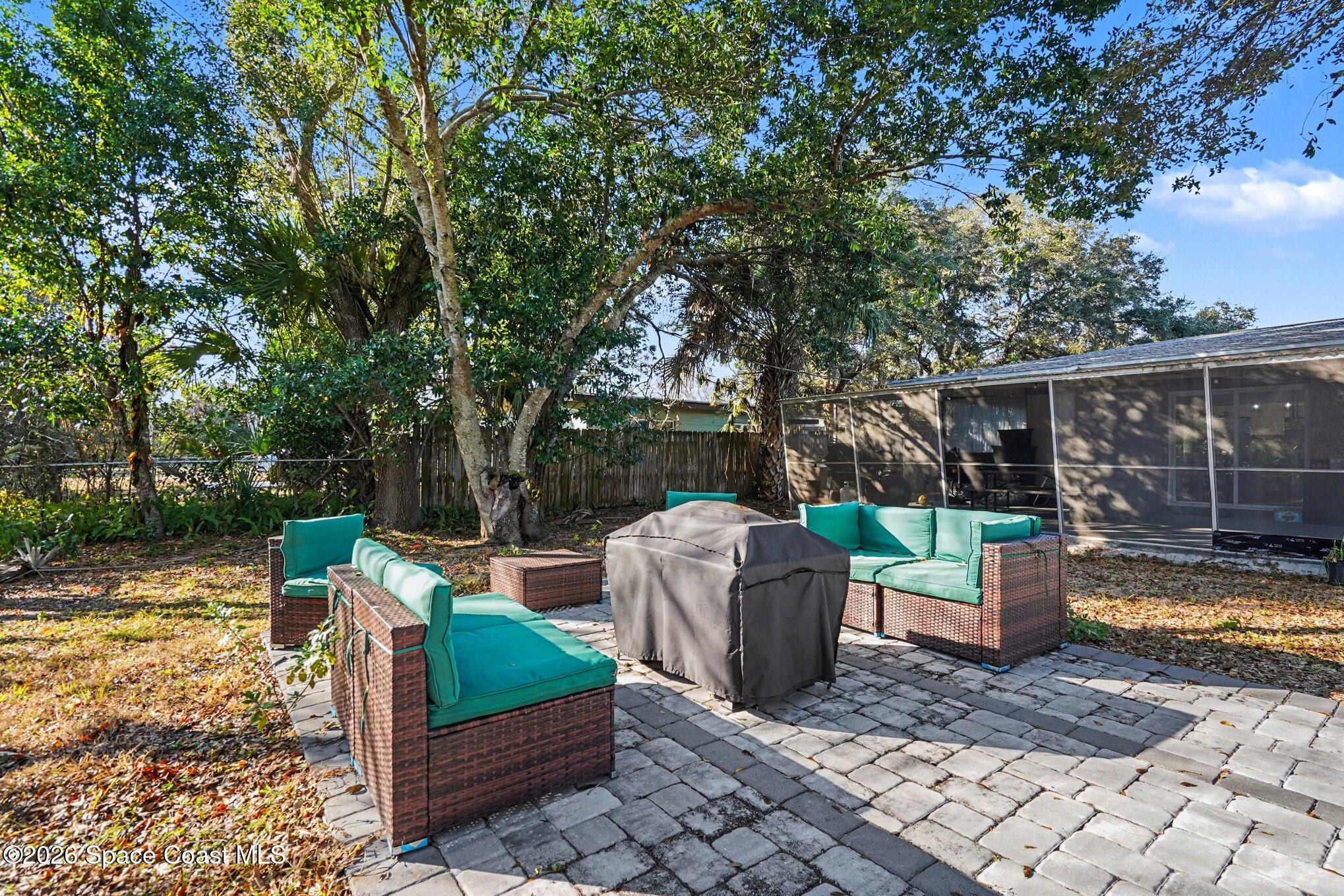 809 Espanola Way Melbourne, FL 32901 - Photo 24 of 27 a view of a deck with furniture and a yard