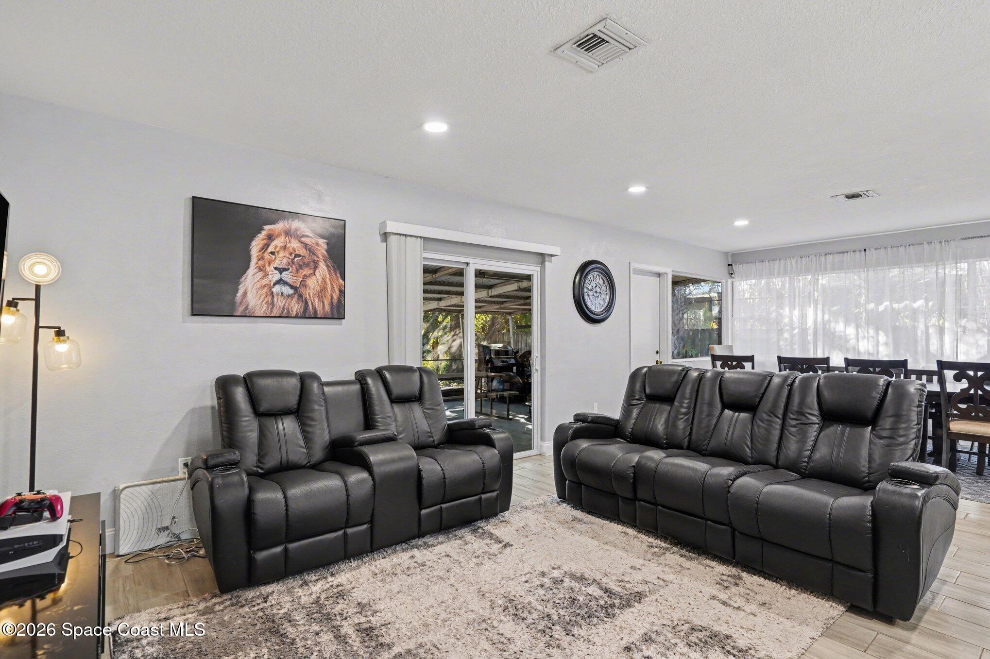 809 Espanola Way Melbourne, FL 32901 - Photo 6 of 27 a living room with furniture and a window