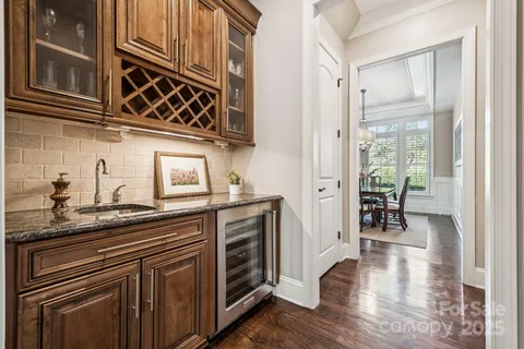 a kitchen with stainless steel appliances granite countertop a sink and cabinets
