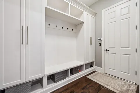 a view of an entryway with wooden floor