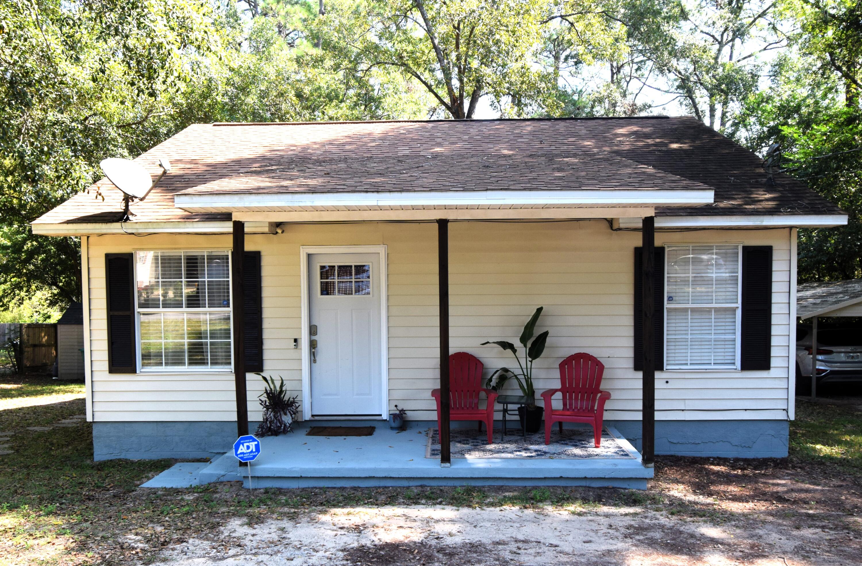 406 Cooper Street Crestview, FL 32539 - Photo 1 of 32 a front view of house with street