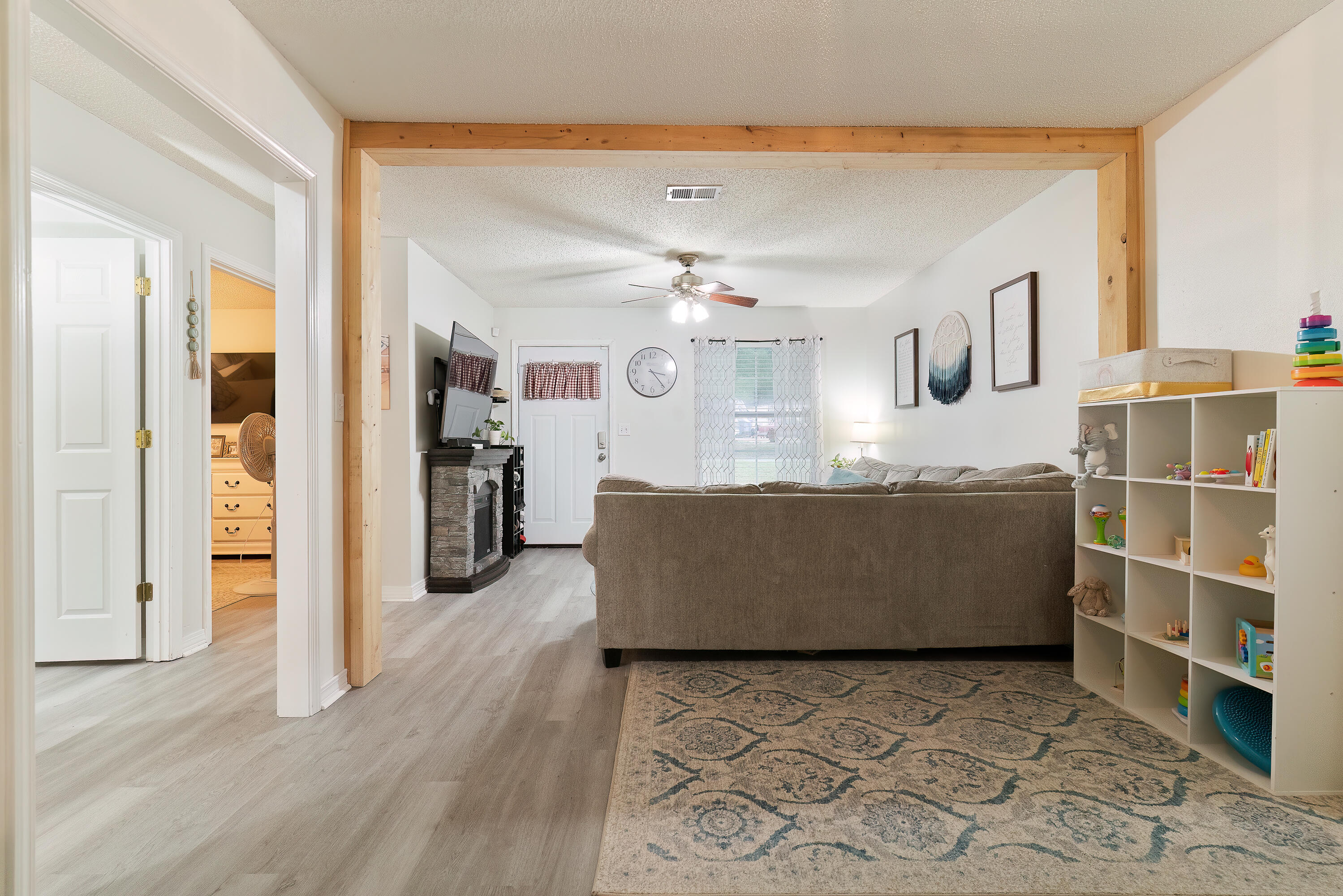 406 Cooper Street Crestview, FL 32539 - Photo 11 of 32 a living room with furniture and kitchen view