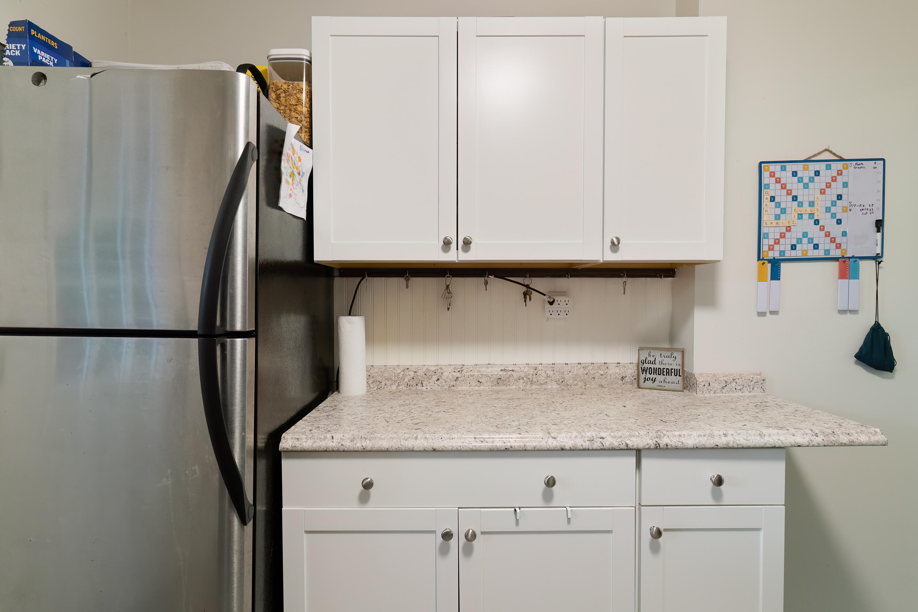 406 Cooper Street Crestview, FL 32539 - Photo 15 of 32 a view of cabinets and refrigerator