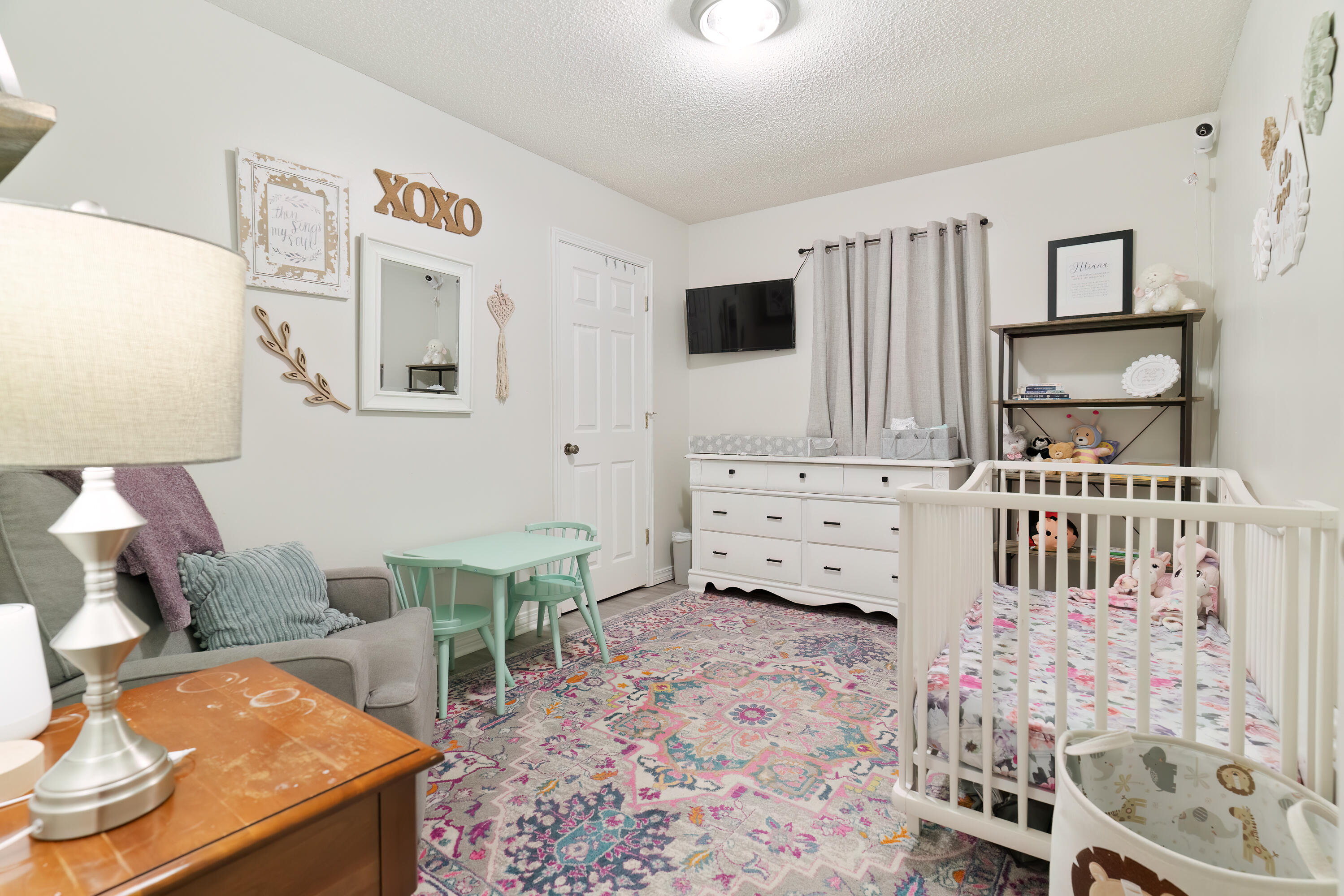 406 Cooper Street Crestview, FL 32539 - Photo 19 of 32 a living room with furniture and a flat screen tv