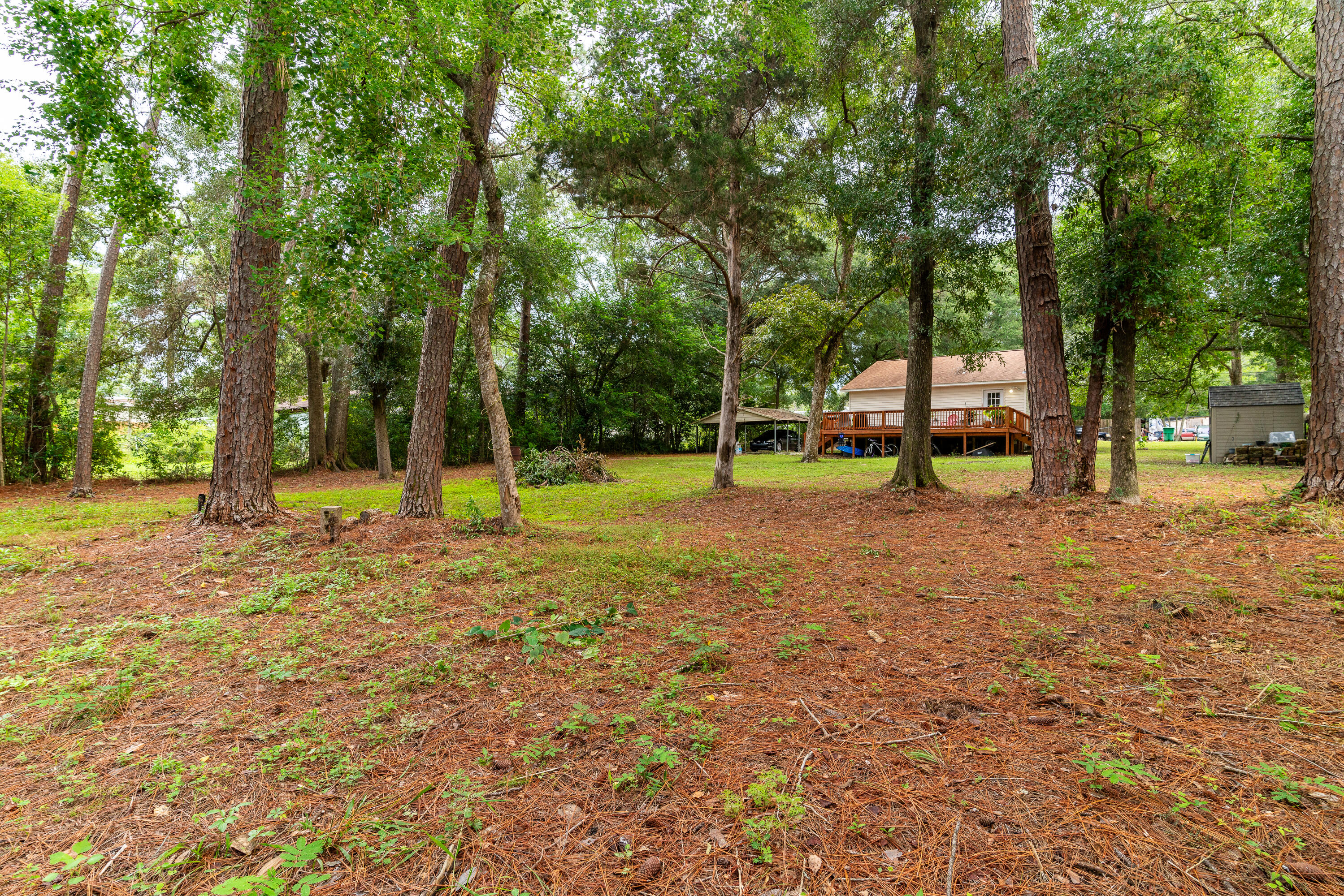406 Cooper Street Crestview, FL 32539 - Photo 28 of 32 a view of a park with swings and slides
