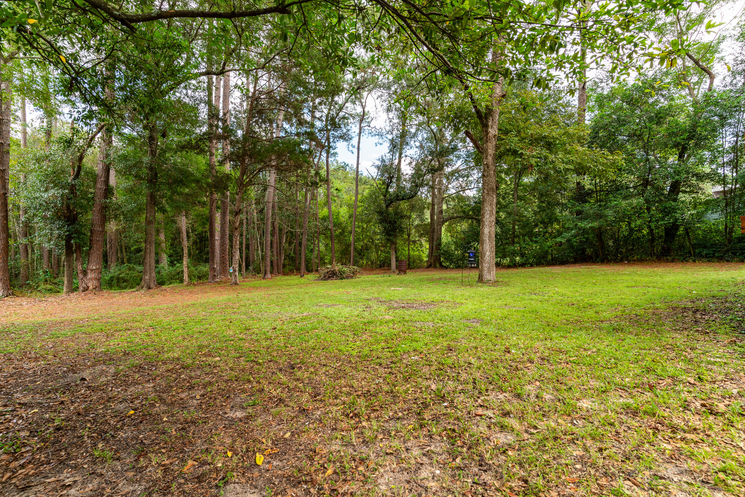 406 Cooper Street Crestview, FL 32539 - Photo 30 of 32 a view of outdoor space with deck and yard