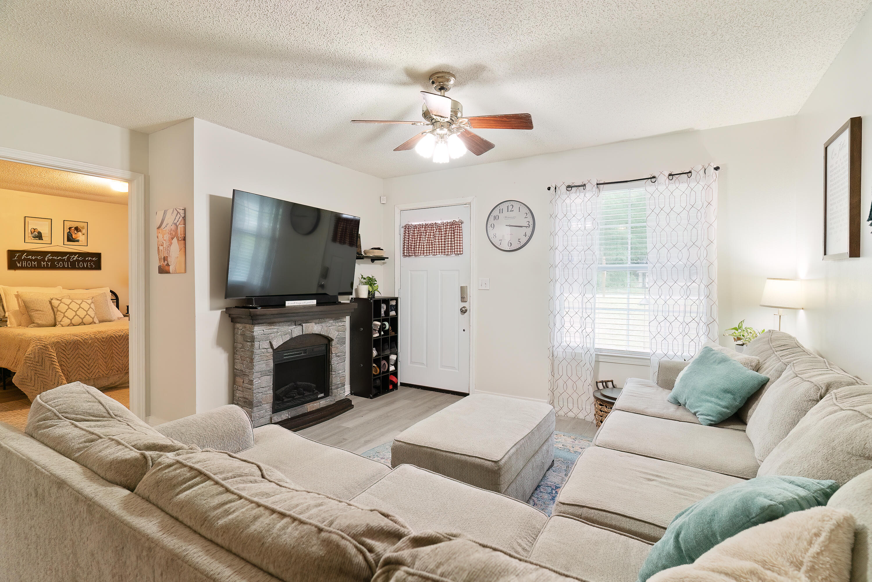 406 Cooper Street Crestview, FL 32539 - Photo 7 of 32 a living room with furniture and a flat screen tv