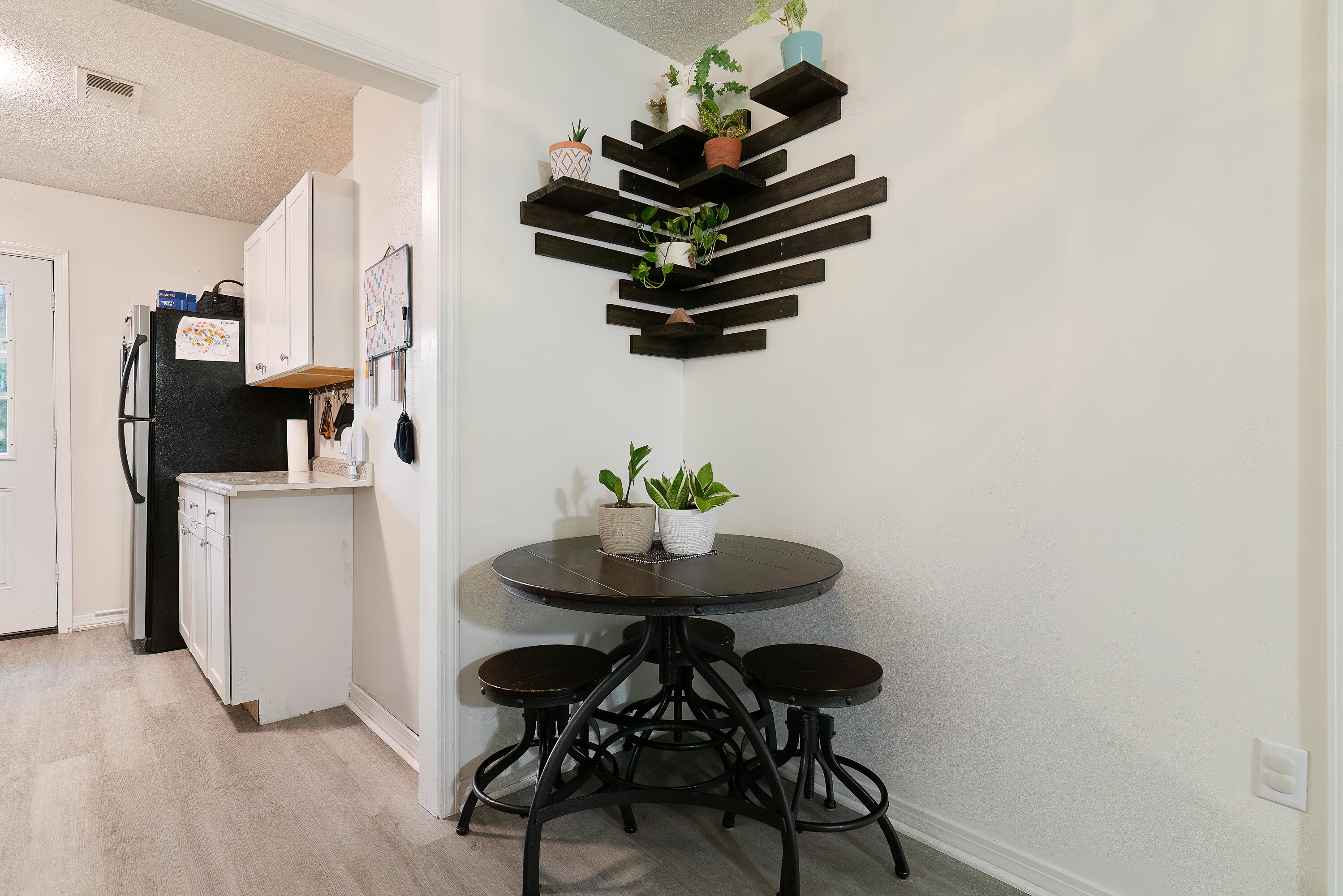 406 Cooper Street Crestview, FL 32539 - Photo 10 of 32 a living room with furniture and a chandelier