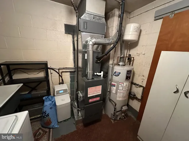 a view of gym equipment and refrigerator