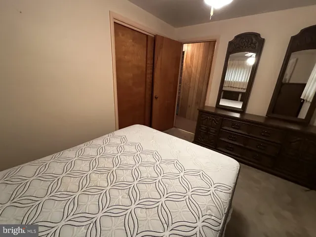 a bedroom with furniture and a window