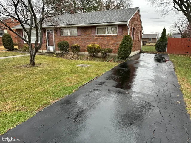 a view of a house with backyard outdoor space and sitting area