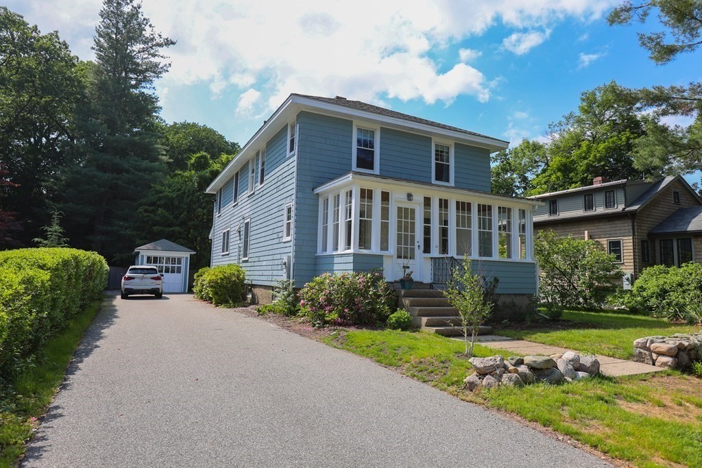 52 Riverdale Road, Unit 52 Wellesley, MA 02481 - Photo 1 of 1 a front view of a house with garden
