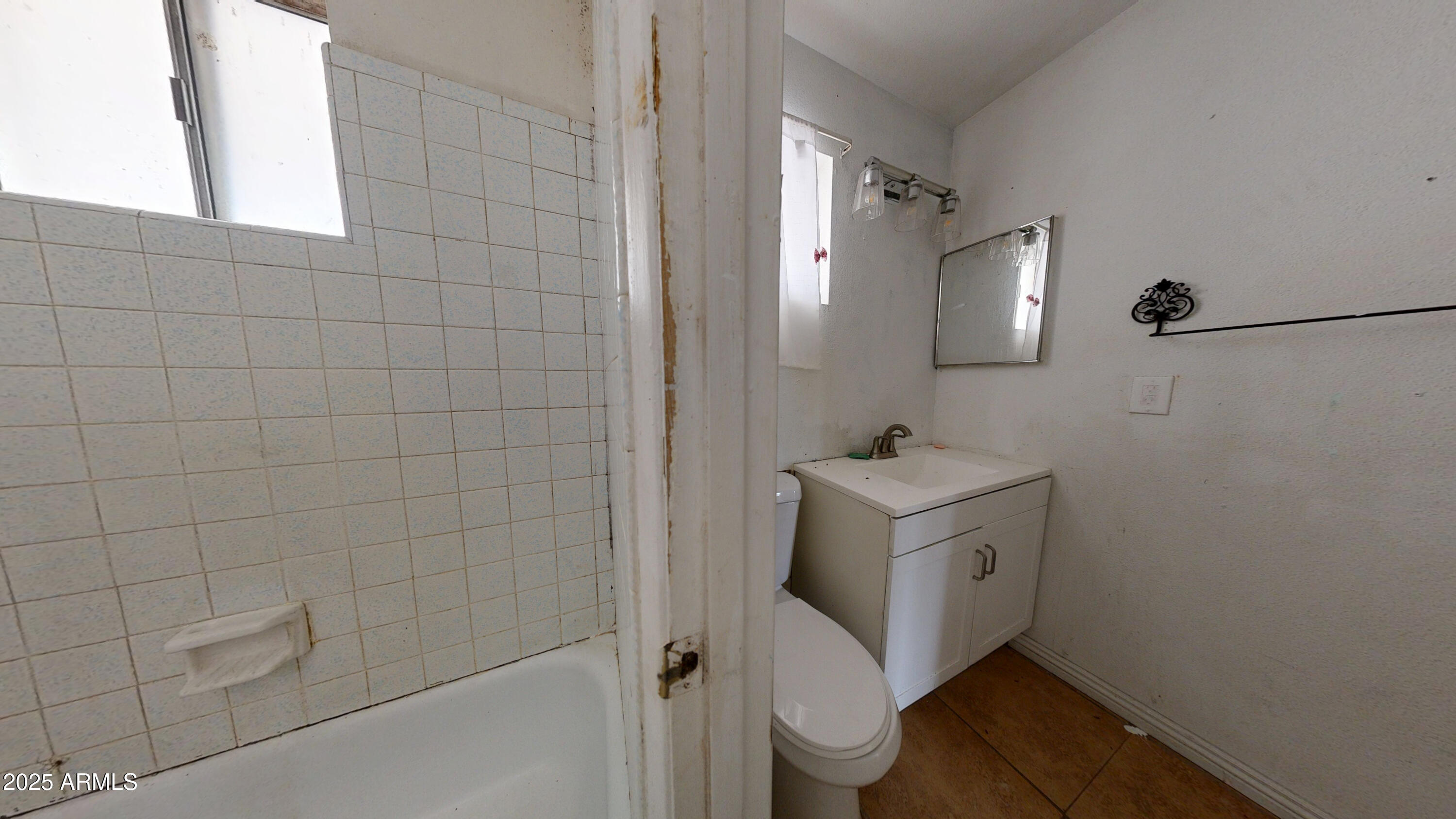 2351 South Royal Palm Road Apache Junction, AZ 85119 - Photo 15 of 21 a bathroom with a sink toilet and shower