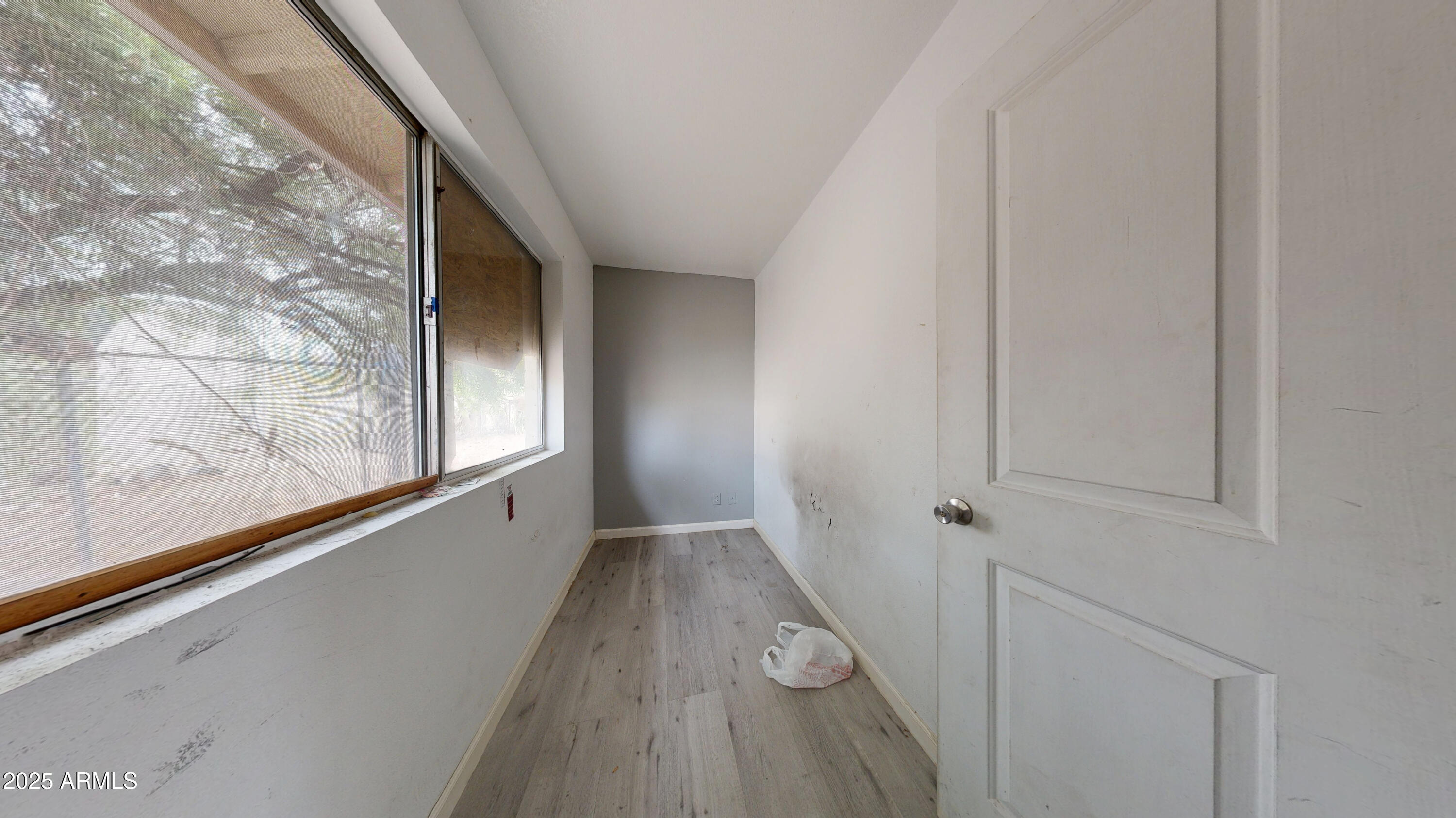 2351 South Royal Palm Road Apache Junction, AZ 85119 - Photo 16 of 21 a view of a hallway with wooden floor and staircase