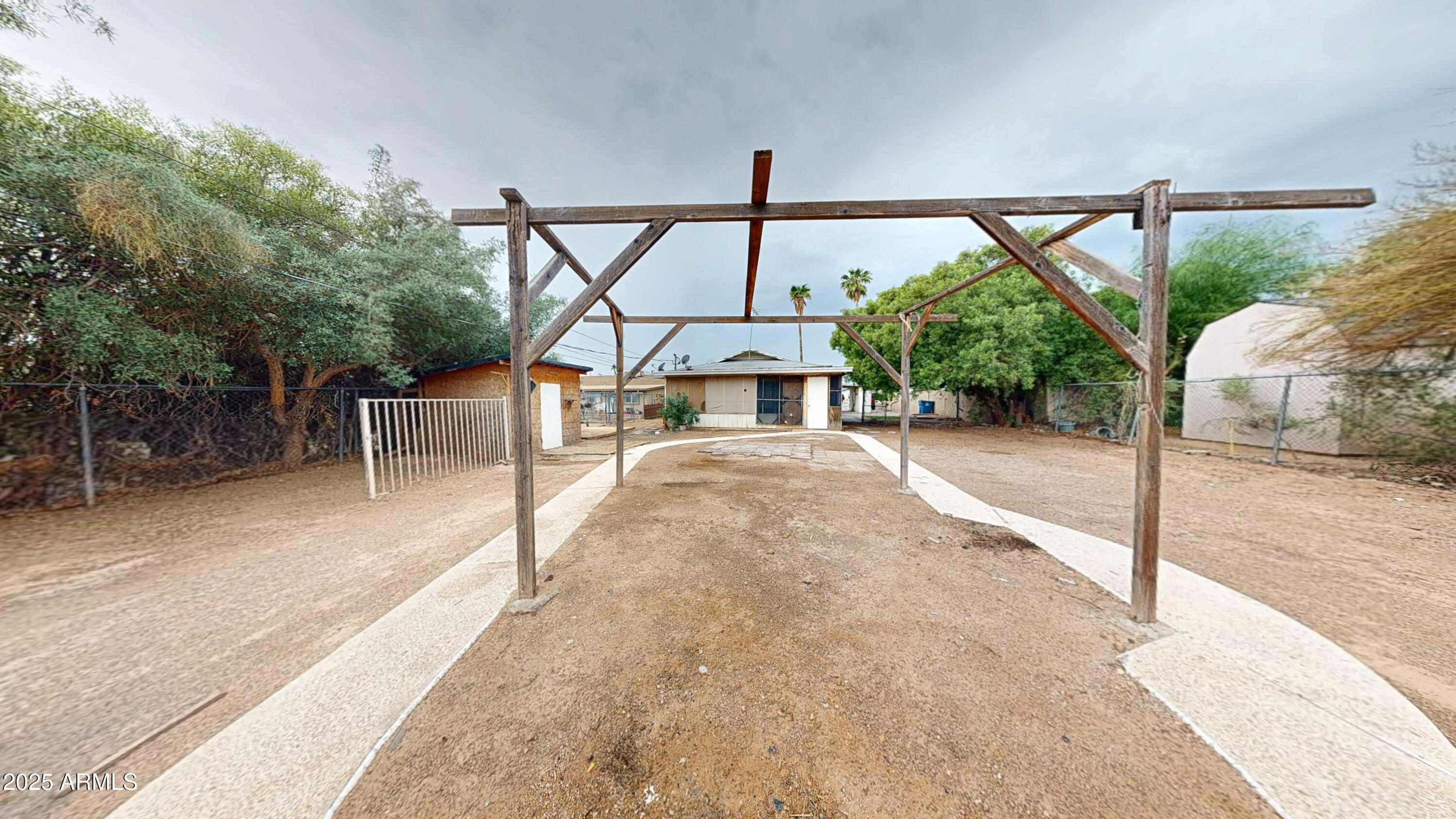 2351 South Royal Palm Road Apache Junction, AZ 85119 - Photo 20 of 21 a view of a porch with furniture and a yard