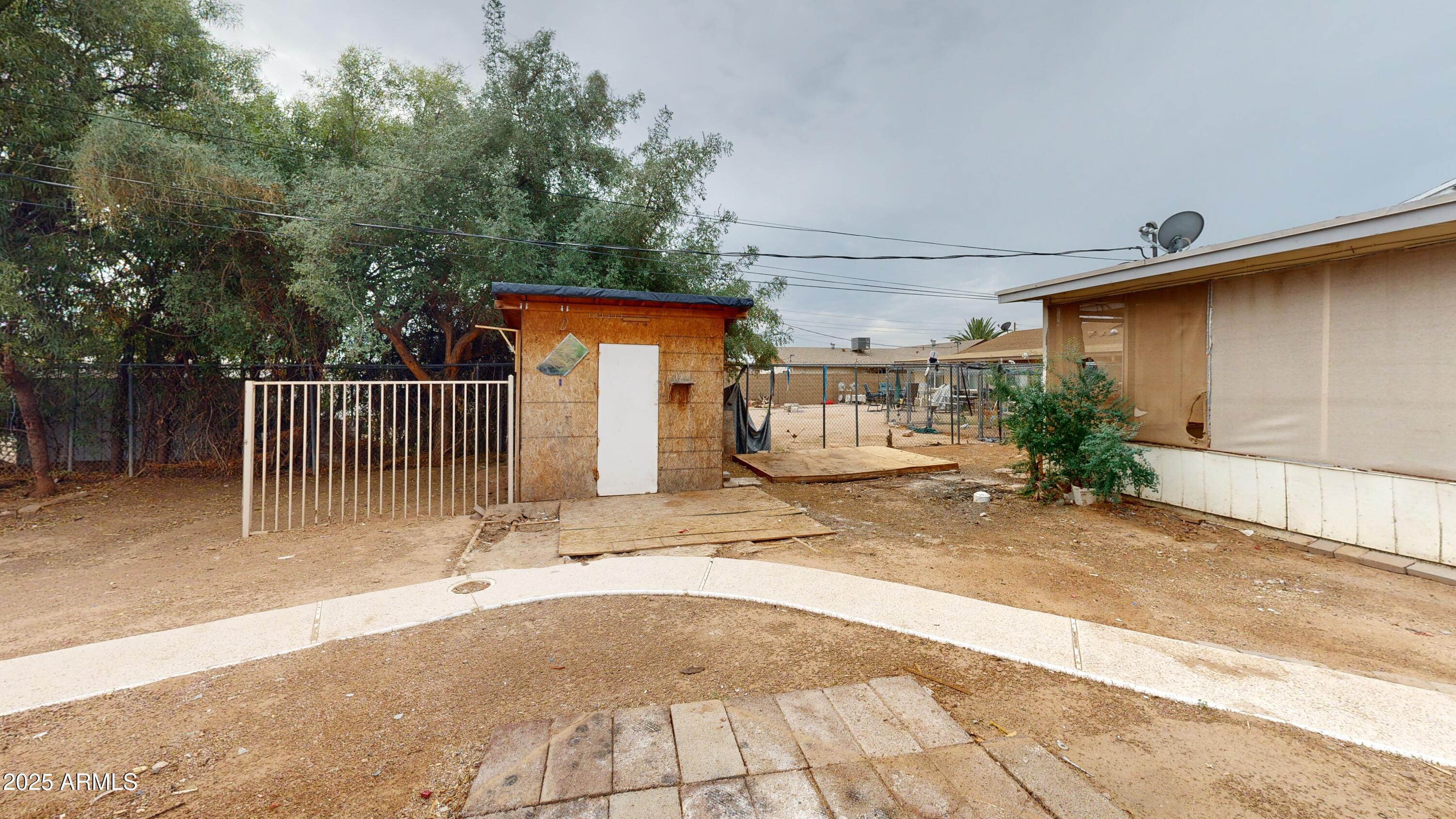 2351 South Royal Palm Road Apache Junction, AZ 85119 - Photo 21 of 21 a view of a house with backyard and sitting area