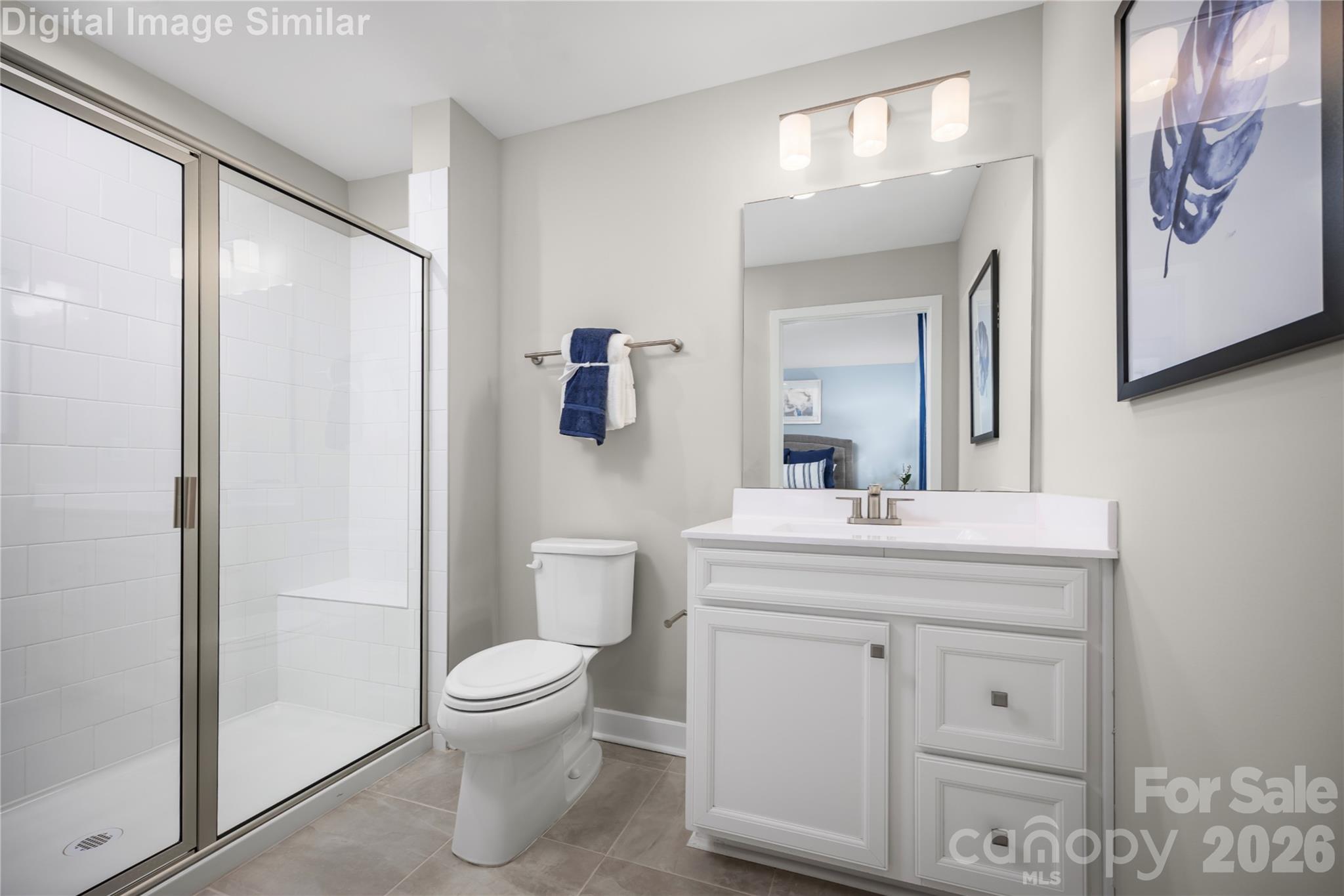 3274 Eller Drive Extension Hickory, NC 28602 - Photo 11 of 20 a bathroom with a toilet a sink and a mirror