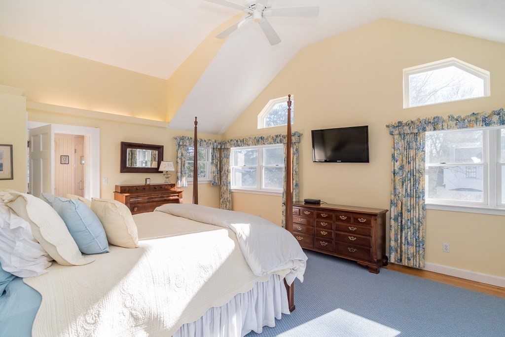 61 Chesterton Road Wellesley, MA 02481 - Photo 17 of 24 a bedroom with a bed a window and a flat screen television
