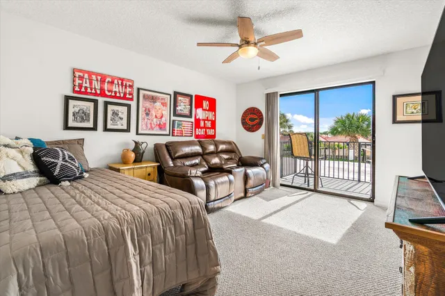 a living room with furniture and a painting on the wall