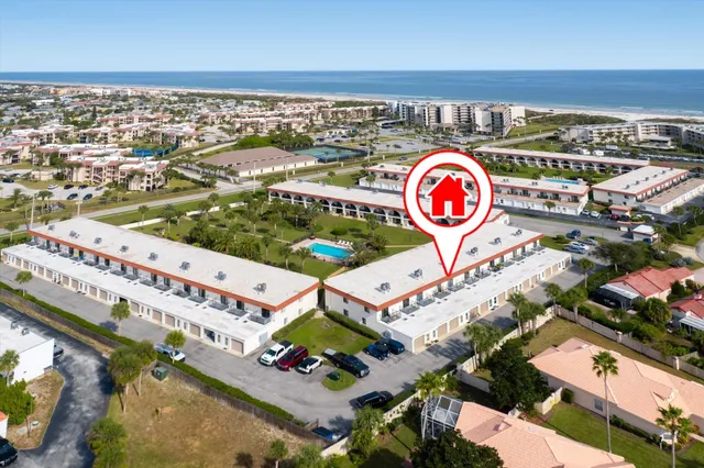 a view of a balcony with a table and chairs