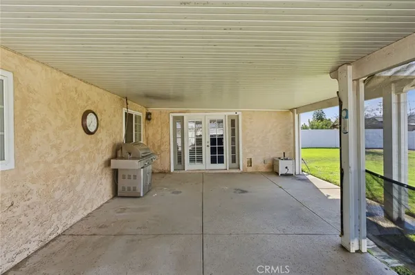a view of house with backyard and deck
