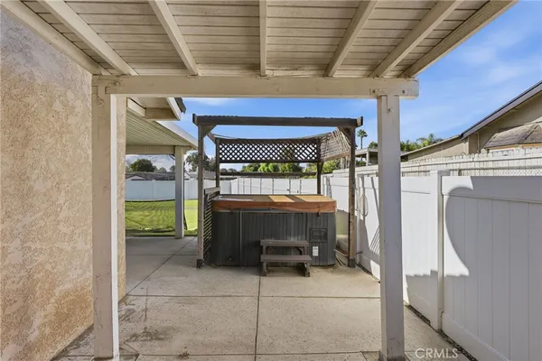 a view of a swimming pool with an outdoor seating and a yard