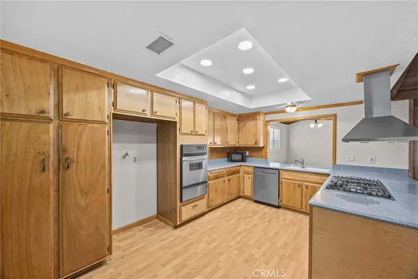 a kitchen with a refrigerator and a sink