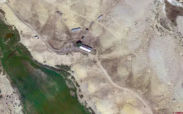 a view of a lake with a yard