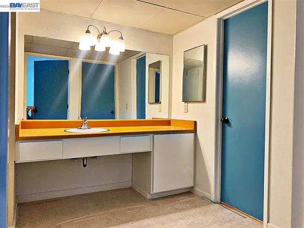 a bathroom with a sink and a mirror