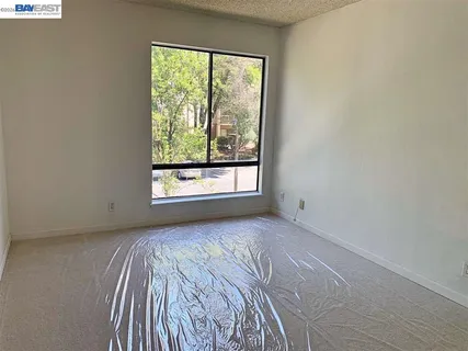 a view of a room that has a window in it