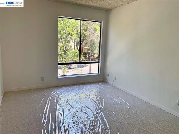 a view of a room that has a window in it