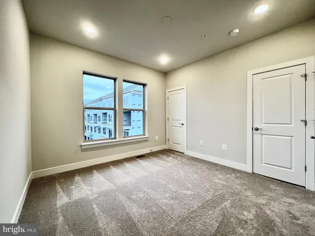 a spacious bathroom with a double vanity sink mirror double and shower