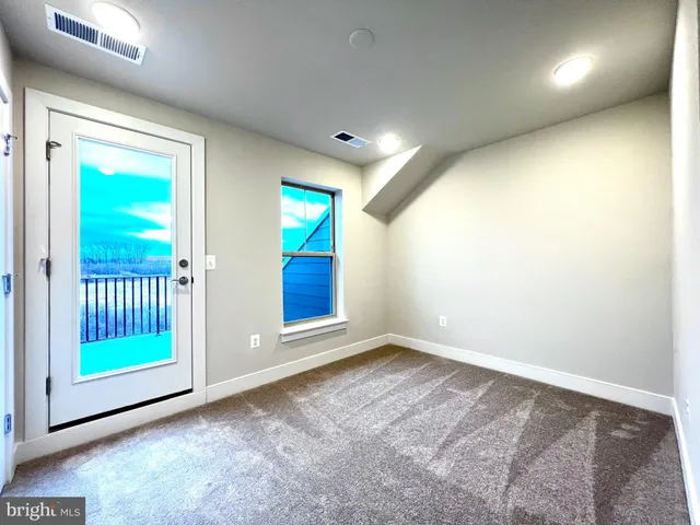 a bathroom with a sink toilet and a mirror