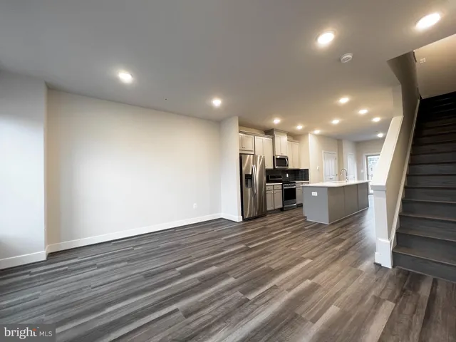 a view of kitchen with wooden floor