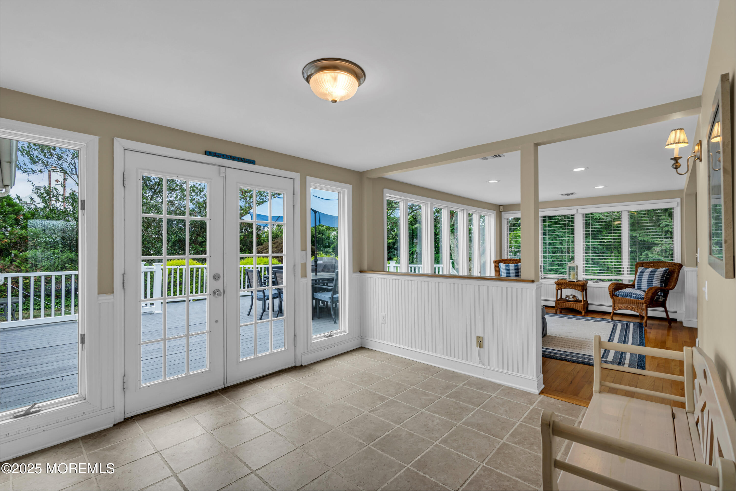 218 3rd Avenue Belmar, NJ 07719 - Photo 7 of 14 a living room with furniture and large windows