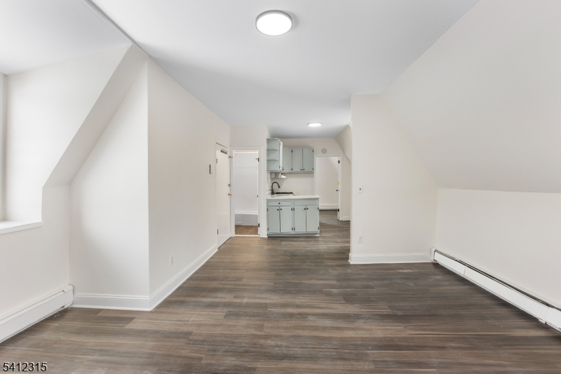 676 Chestnut Street, Unit 3 Kearny, NJ 07032 - Photo 11 of 21 a view of kitchen with wooden floor