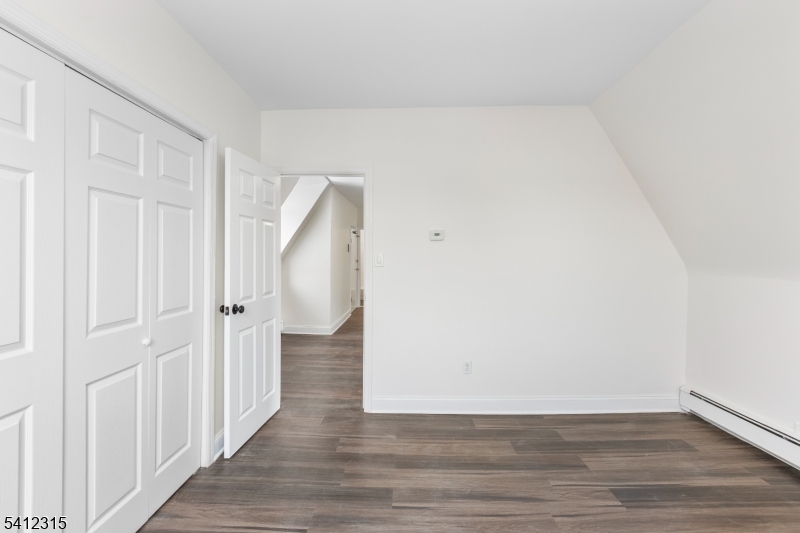 676 Chestnut Street, Unit 3 Kearny, NJ 07032 - Photo 16 of 21 a view of an empty room with wooden floor