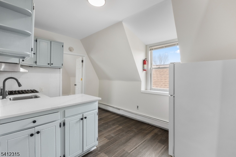 676 Chestnut Street, Unit 3 Kearny, NJ 07032 - Photo 5 of 21 a room with a sink cabinets and wooden floor