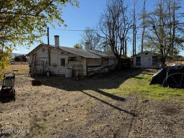 a front view of a house with a yard covered in snow